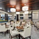 Tables and chairs set up in a hotel restaurant