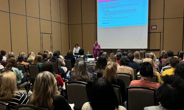 School counselors attending a professional development session at a school counseling conference.