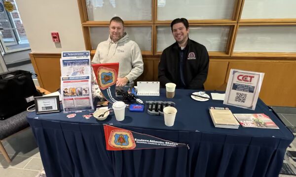 Exhibitors sitting at a conference table