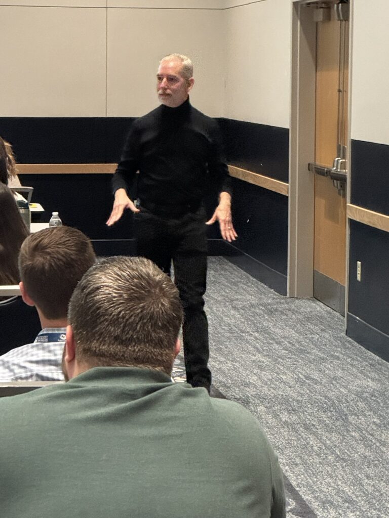 Keynote speaker Dan St. Romain presenting to a group of counselors