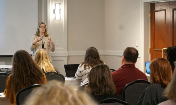 Presenter speaking at a conference
