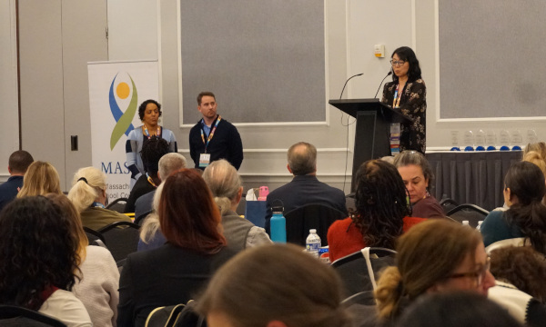 Presenter speaking at a conference
