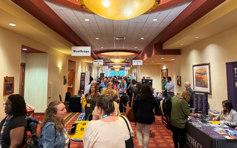 Busy exhibit hall filled with school counselors, administrators, and exhibitors at the Southeast School Counselor and Administrator Leadership Institute.