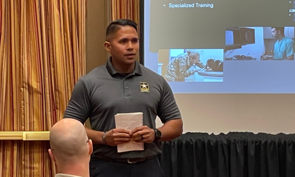Presenter from the U.S. Army speaking to attendees during a conference session at the Southeast School Counselor and Administrator Leadership Institute.